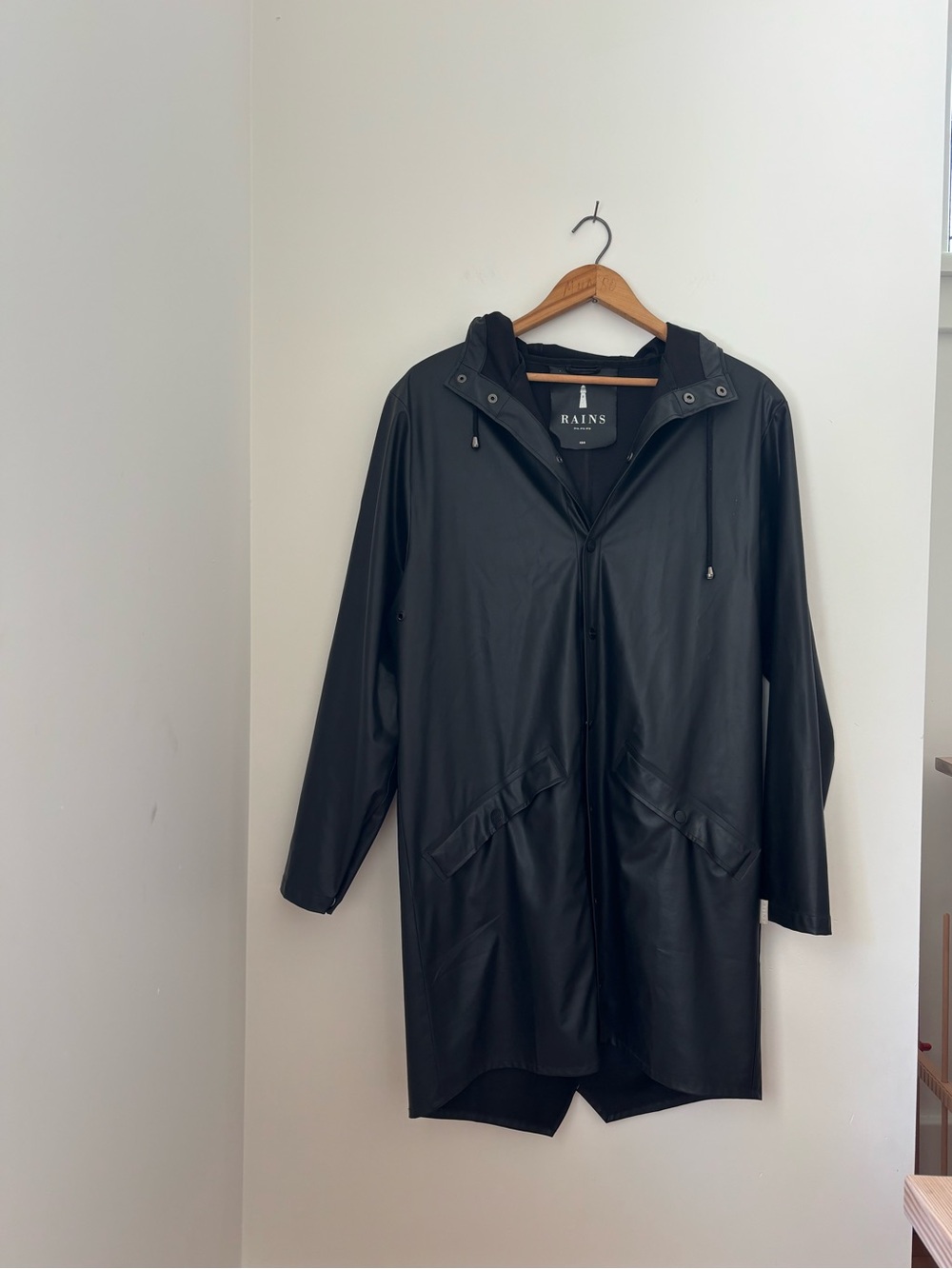 Rains long jacket minimalist black raincoat Danish design
